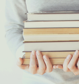 Hands holding books
